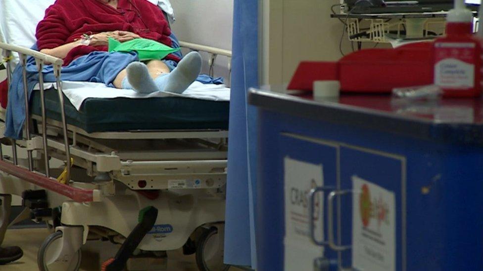 Patient on a bed at the Leicester Royal Infirmary