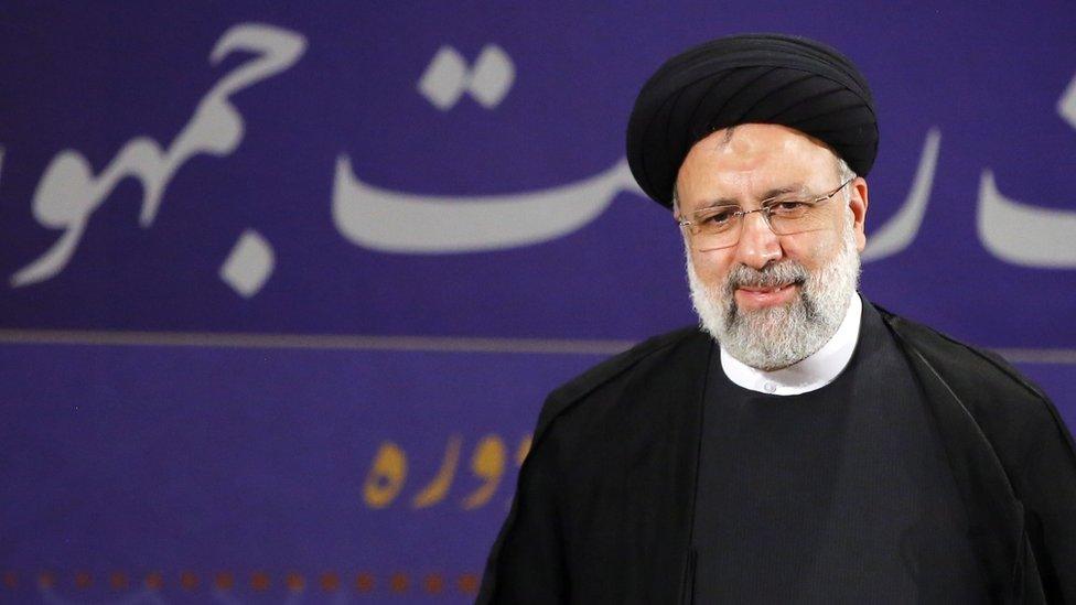 Ebrahim Raisi speaks to reporters after registering as a candidate for the Iranian presidential election (15 May 2021)