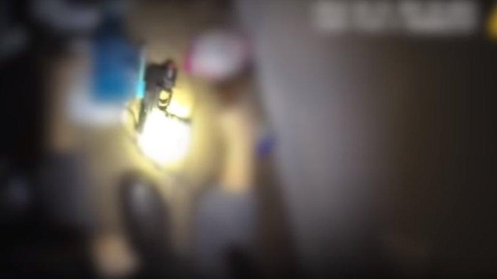 Still frame shows weapon inside property