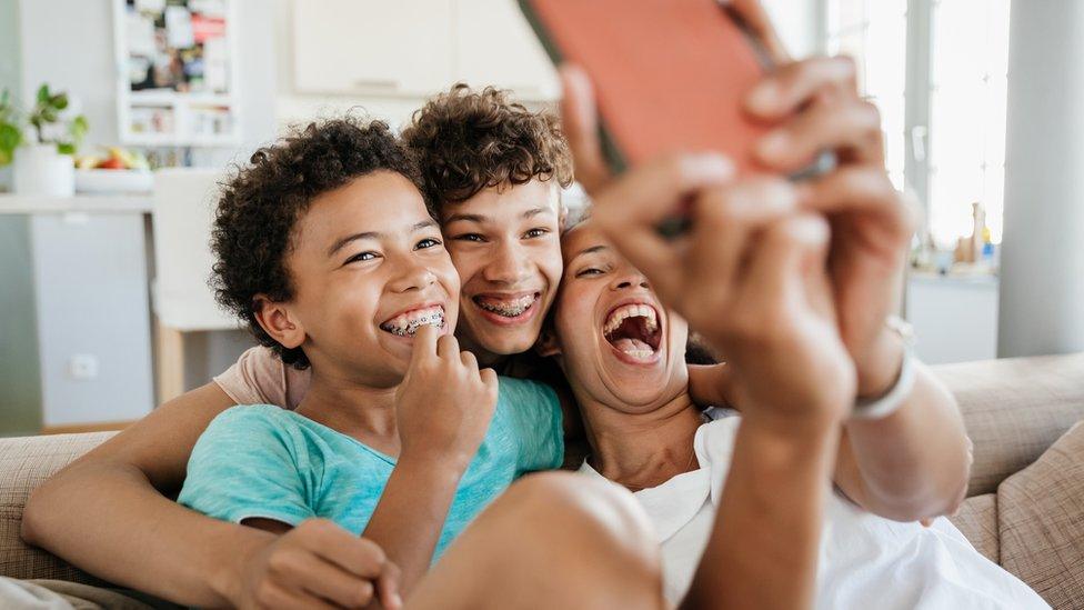 Siblings taking a selfie