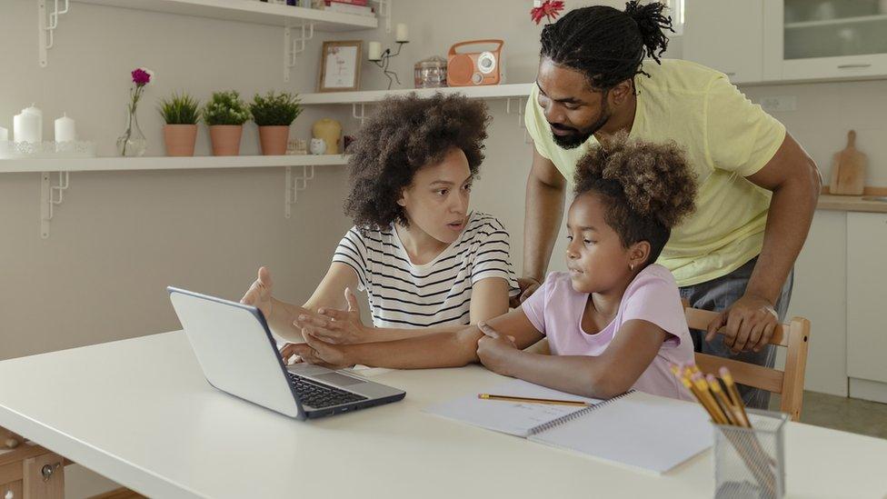 child-learning-from-home-with-parents