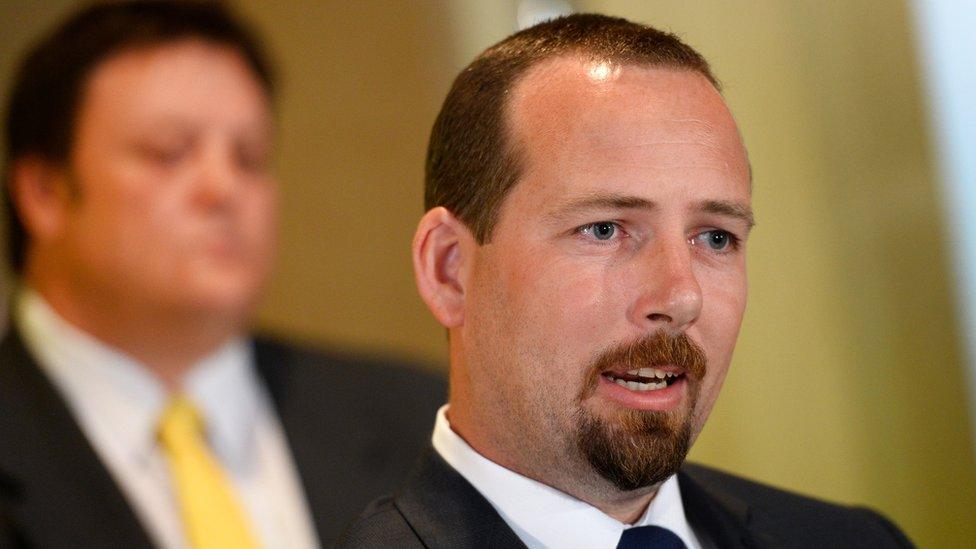 Australian Motoring Euthusiast Party (AMEP) senator Ricky Muir (R) speaks during a press conference