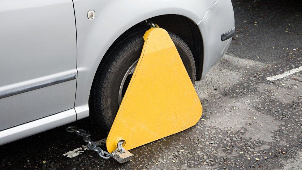 Car wheel clamped