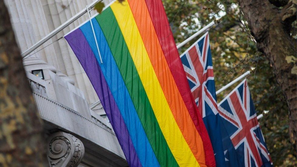 The rainbow flag hangs in front of Australian flags outside Australia House on November 16, 2017 in London, England. Australia voted yesterday to legalise same-sex marriage in a historic poll.