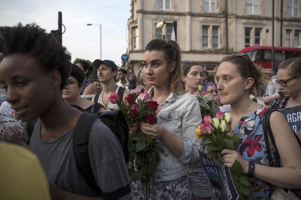 People waiting with roses