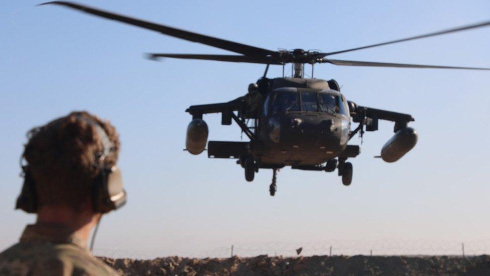 A U.S. Army Soldier assigned to the 3rd Calvary Regiment observes a UH-60 Blackhawk take off from an improvised landing zone during training at Firebase Sa-ham, Iraq, Dec. 9, 2018. The 3rd Cav. Regt. is deployed in support of Operation Inherent Resolve, working by, with, and through the Iraqi Security Forces and Coalition partners to defeat ISIS