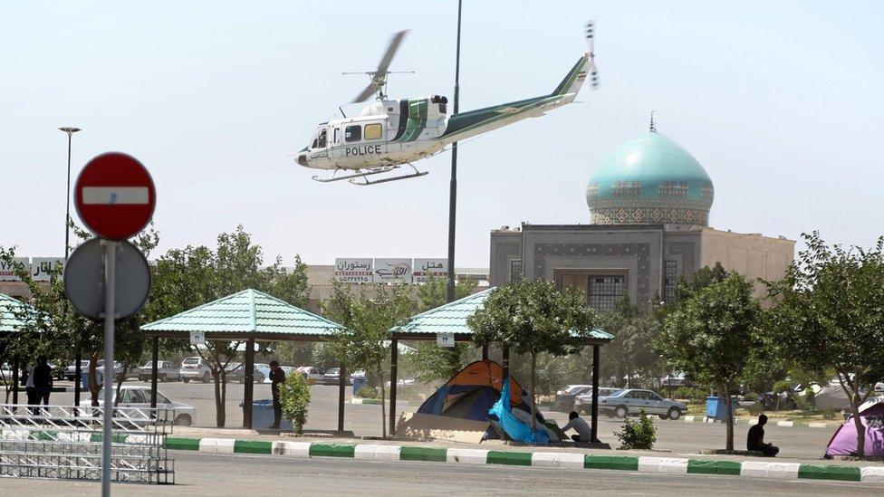 A police helicopter flies near the the mausoleum of Ayatollah Ruhollah Khomeini in Tehran, Iran (7 June 2017)