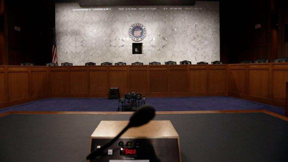 The witness table where former FBI Director James Comey will sit faces a panel of empty chairs