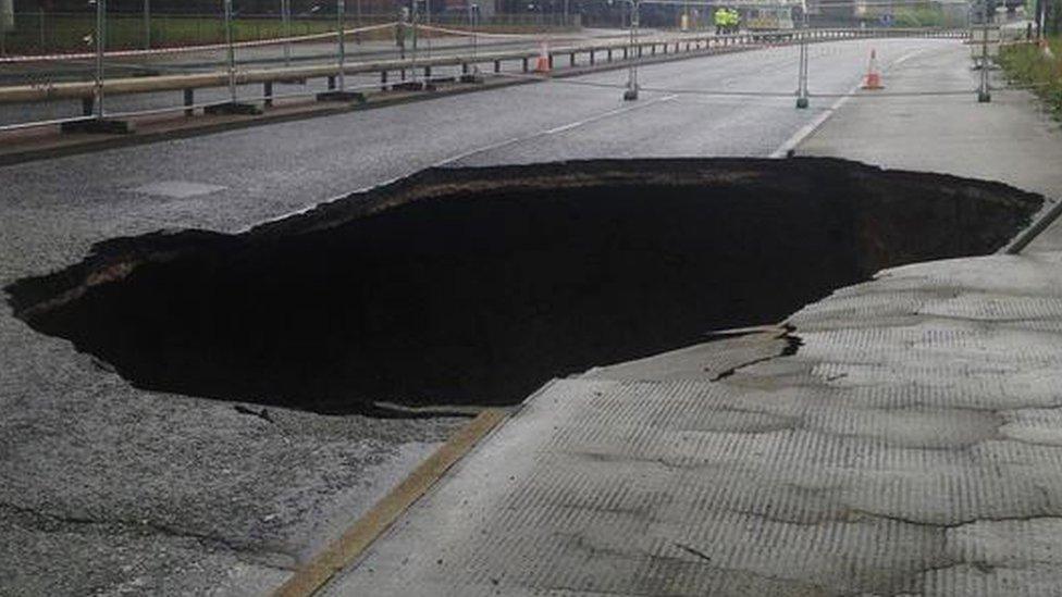 A large sinkhole which appeared in Mancunian Way, Manchester