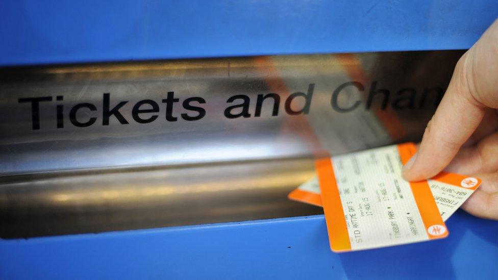 Tickets being bought from automatic machine