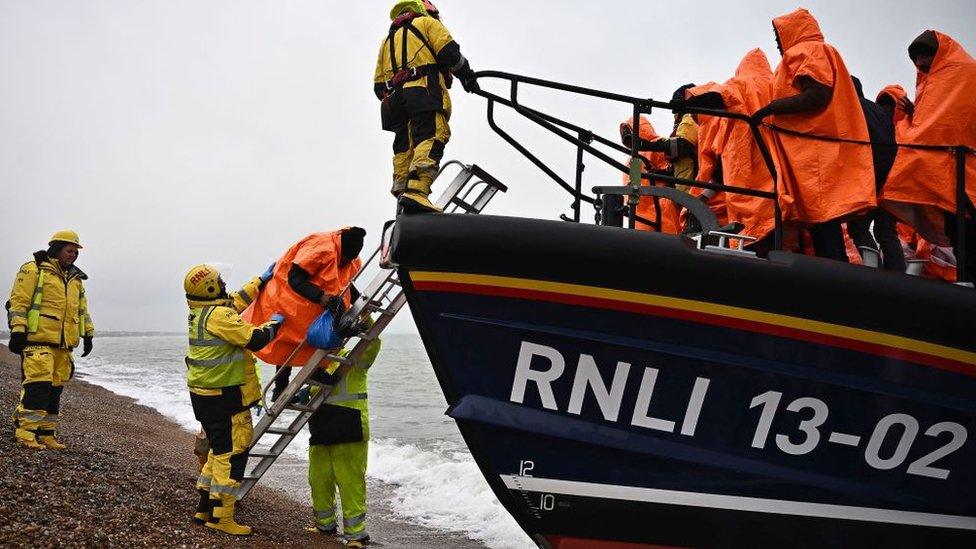 A RNLI lifeboat helps people ashore in Kent, after they attempted to cross the Channel on 9 December