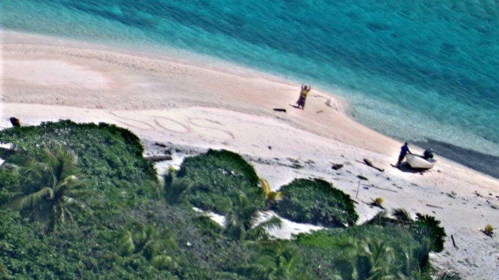 SOS sign on island