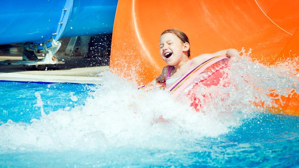 Child on water slide