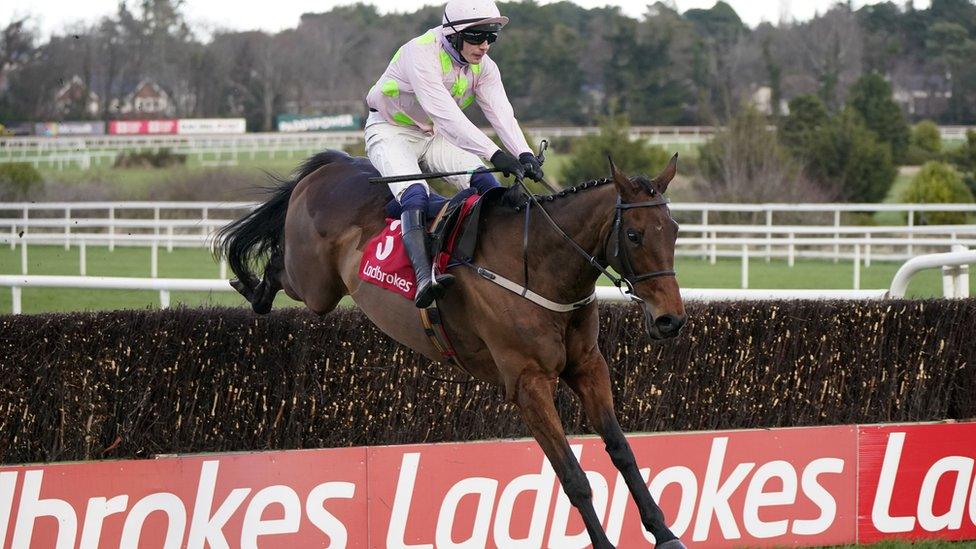 Horse racing with Ladbrokes sign