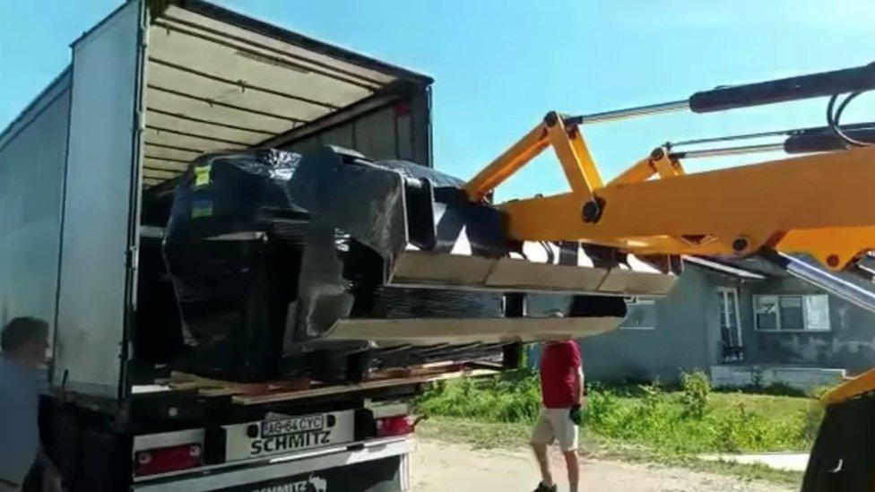 Aid being unloaded in Romania