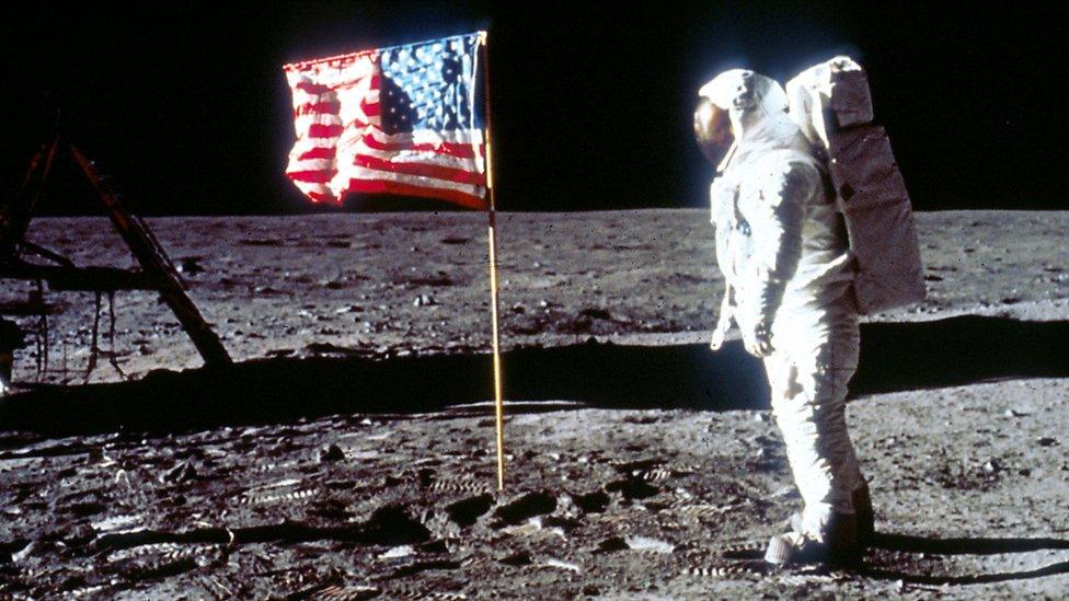 Astronaut Buzz Aldrin poses next to the U.S. flag July 20, 1969 on the moon during the Apollo 11 mission.