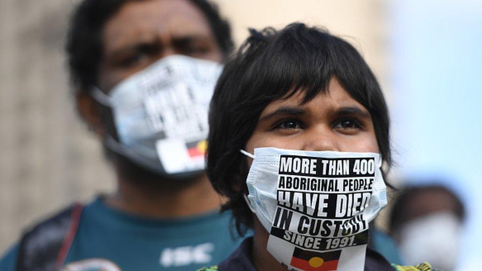 Protesters march in solidarity with protests in the United States in Adelaide, Australia