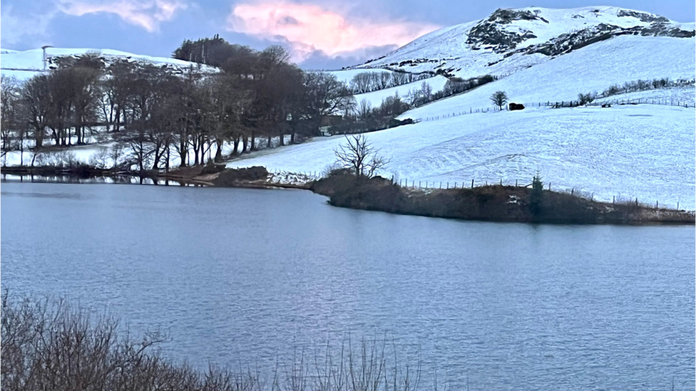 Snowy hillside and lake at Devils Bridge, Ceredigion