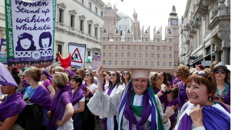 Woman in Parliament-shaped hat