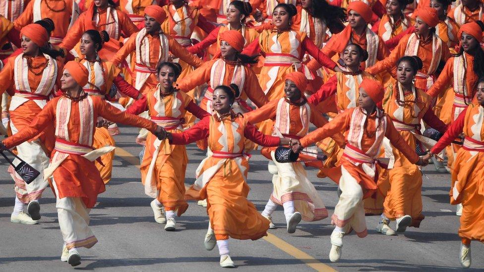 Schoolchildren dance on Rajpath during the Republic Day parade in New Delhi on 26 January 2020.