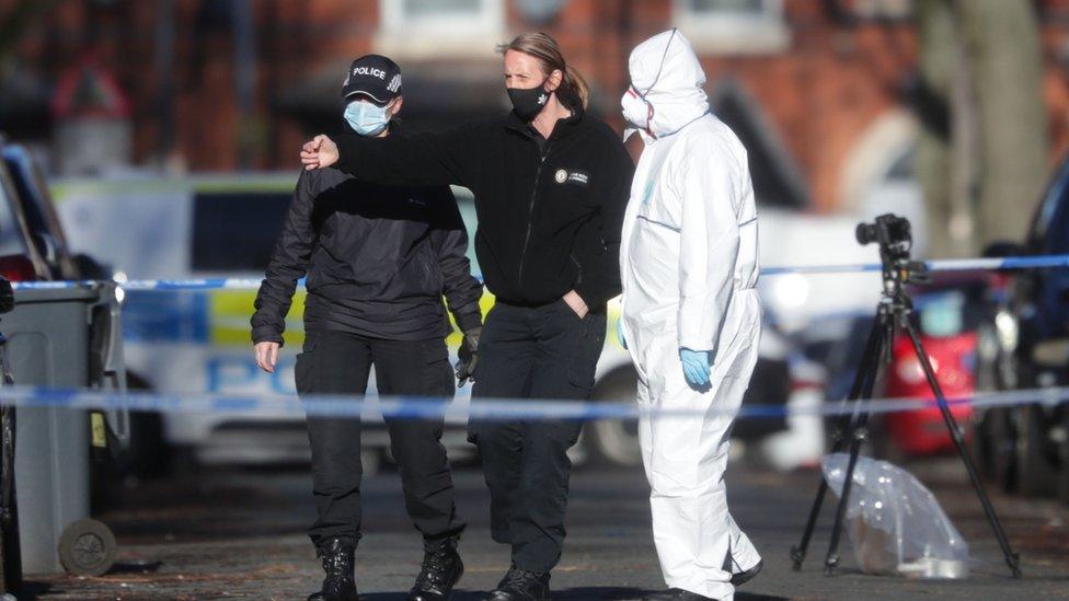 Police officers searching the scene in Linwood Road, Handsworth