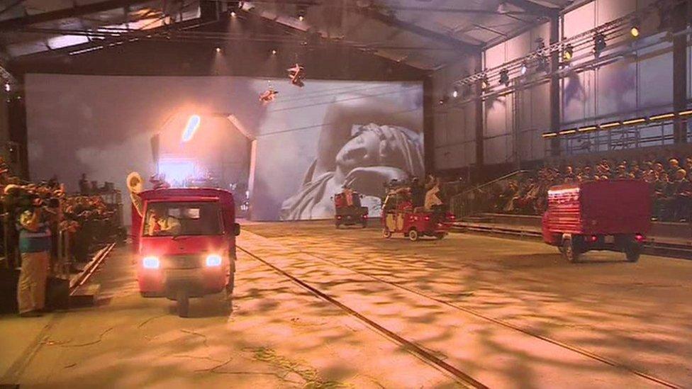 Milk floats drive during the opening ceremony for the Gotthard railway tunnel - 1 June 2016