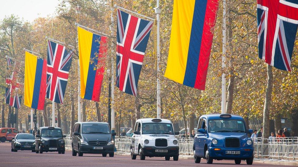 Flags of the UK and Colombia flying on the Mall, London, ahead of the state visit the Colombian president Juan Manuel Santos