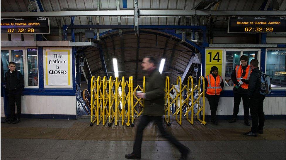 Man walking past closed platform