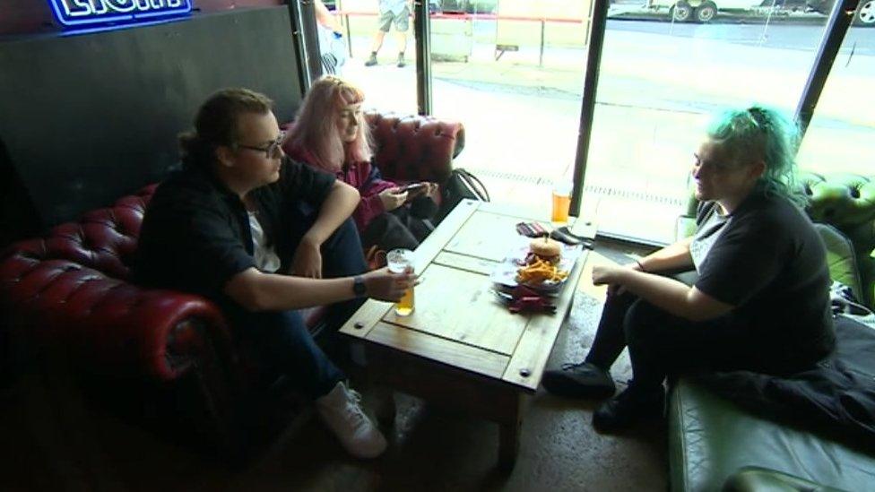 Students having a drink and food