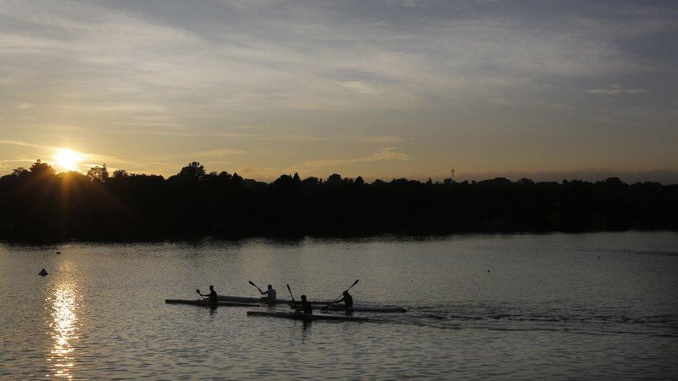 Canoeists training on Emmarentia Dam at sunrise near Johannesburg, South Africa - Thursday 9 February 2017