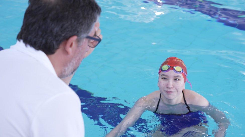 Andrea and her trainer