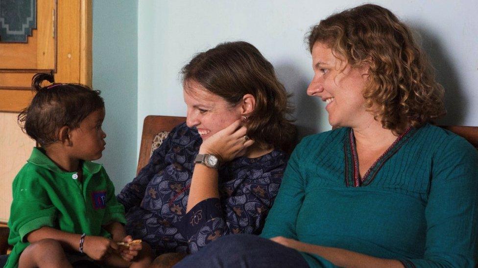 Dr Cat Morris and Dr Mary Cusack with a child they are helping