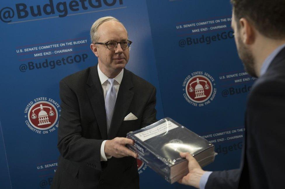 Republican congressmen distribute the White House budget proposal