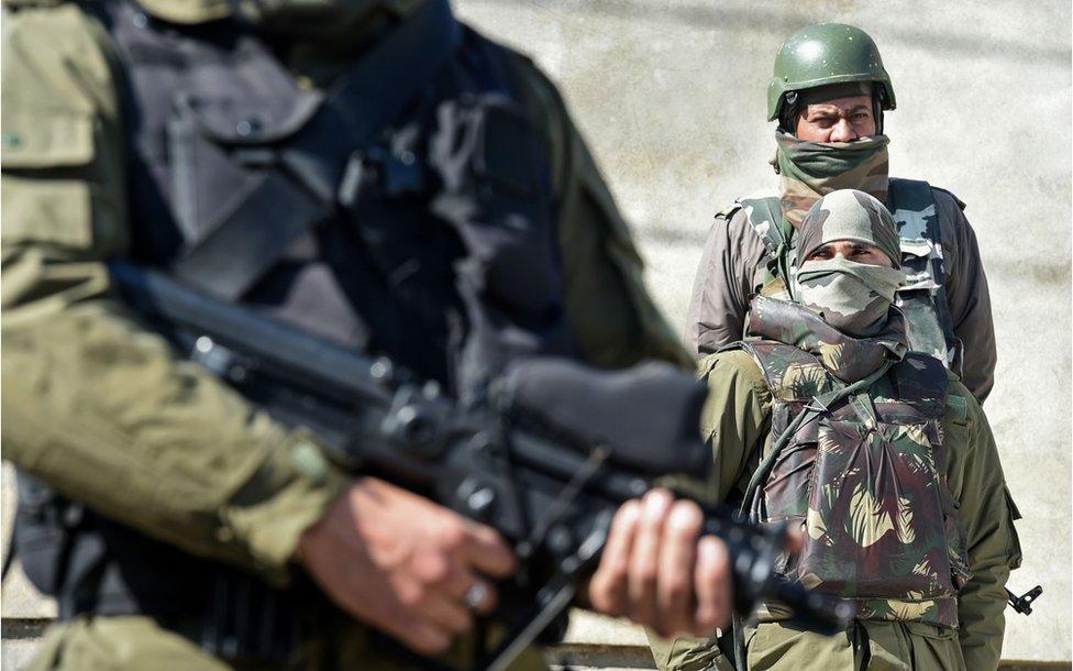 Indian paramilitary troops stand guard at the hospital in Srinagar