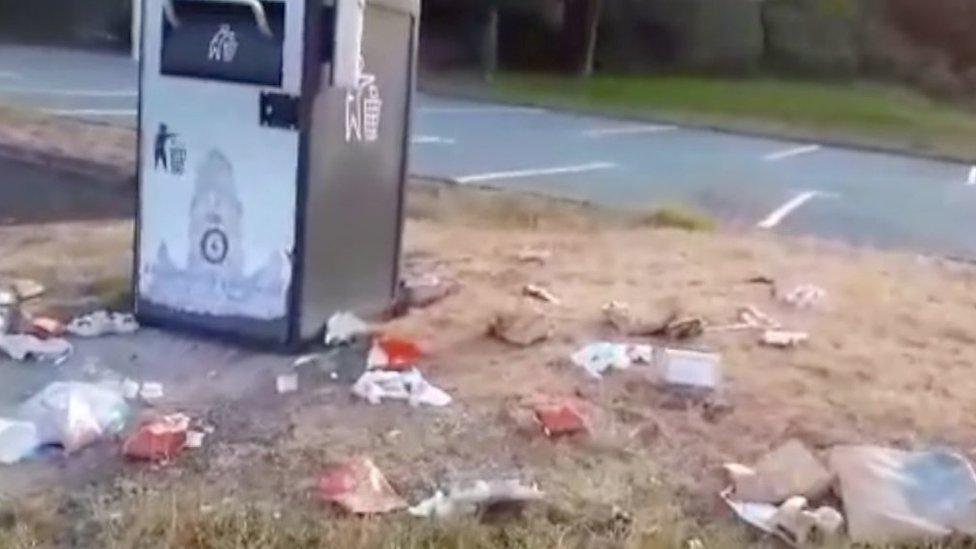 Litter left by a bin in Powys