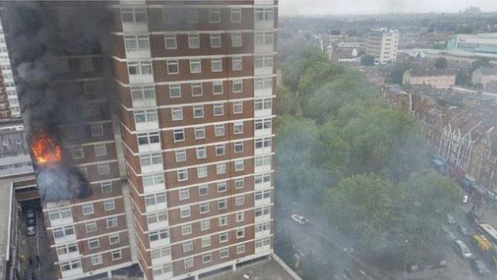 A fire rages in a flat in the Shepherd's Court tower block in west London