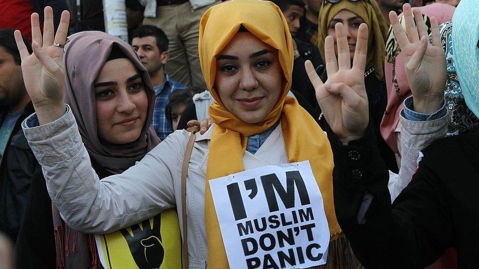 Supporters of the Egyptian Muslim Brotherhood take part in a rally to protest against the death penalties for the members of the radical group in Egypt, outside the Egyptian embassy in Ankara on April 9, 201