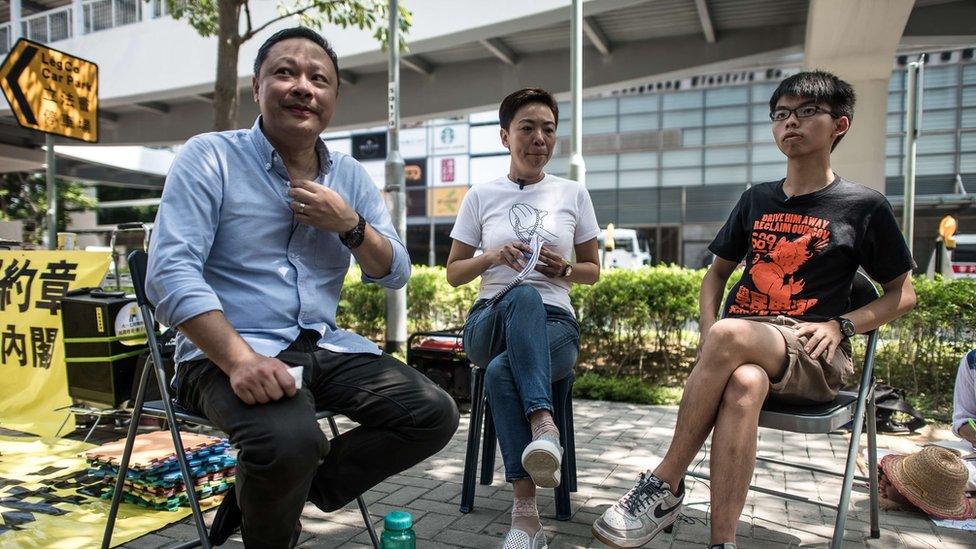 Occupy Central movement co-founder Benny Tai (left) is seen with Joshua Wong (right) and an unnamed woman (centre) during an interview in September 2015, one year on from the start of pro-democracy rallies in Hong Kong