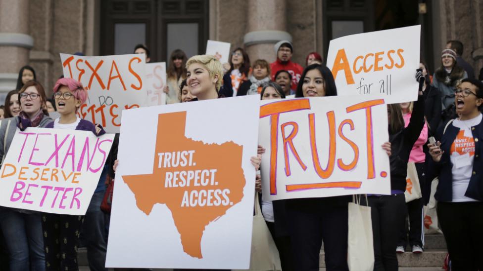 College students and abortion rights activists hold signs during a rally on the steps of the Texas Capitol, in Austin, Texas - 26 February 2015