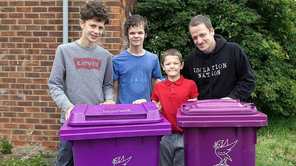 Geelan family with the bins