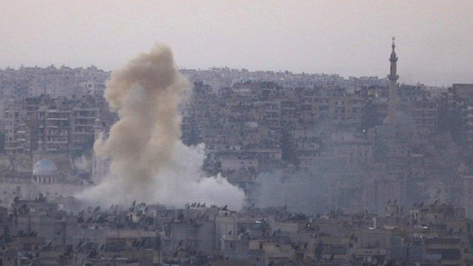 Smoke rises from Bustan al-Basha neighborhood of Aleppo