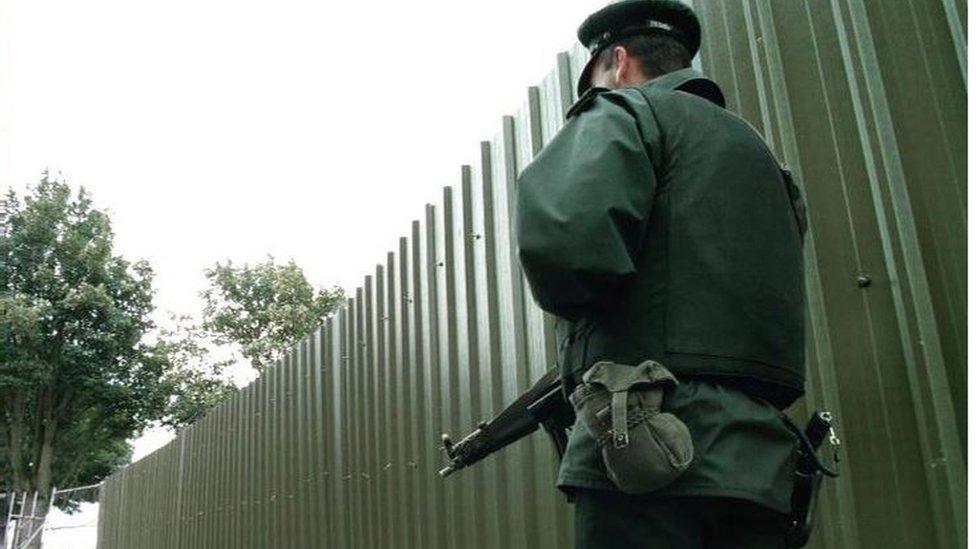 A police officer at the city walls in Derry