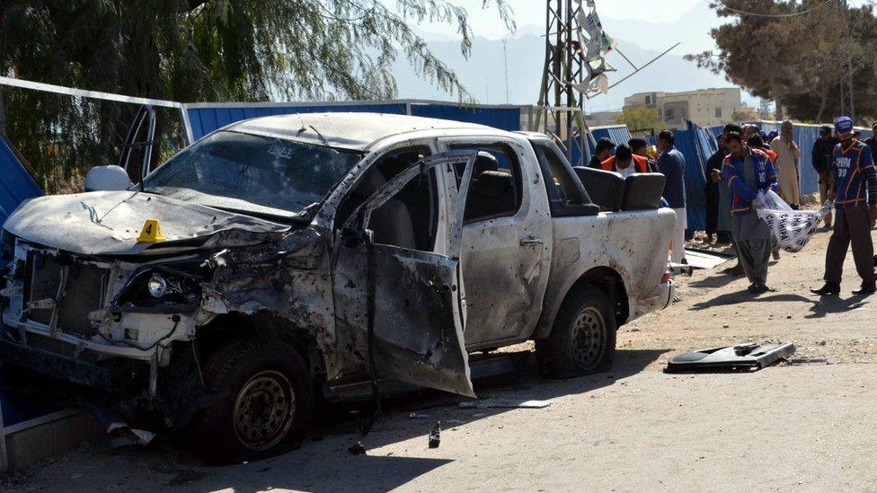 Pakistani security officials inspect the scene of a bomb blast that reportedly targeted a senior police official in restive Quetta