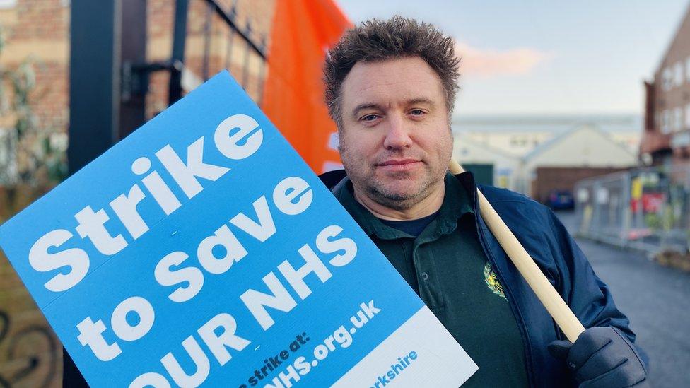 Jamie Frend, GMB, with placard