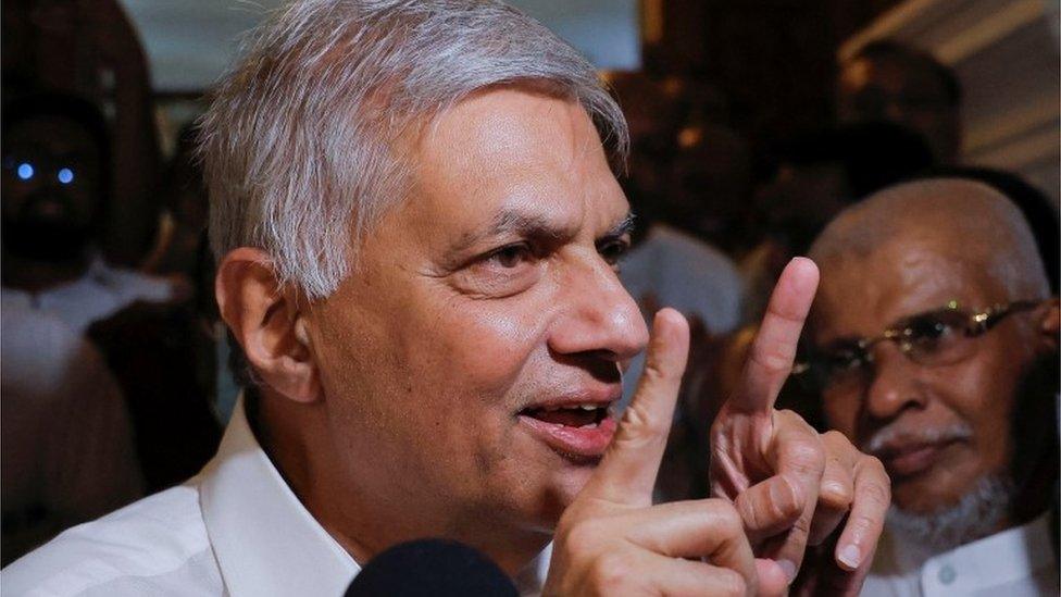 Ranil Wickremesinghe as he leaves a Buddhist temple in Colombo, 20 July