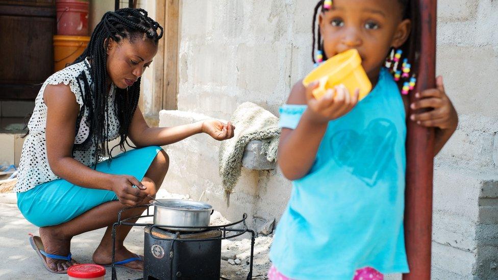 Esther Henry John prepares tea with environmentally friendly charcoal at her home in Dar es Salaam, Tanzania on March 10, 2015.