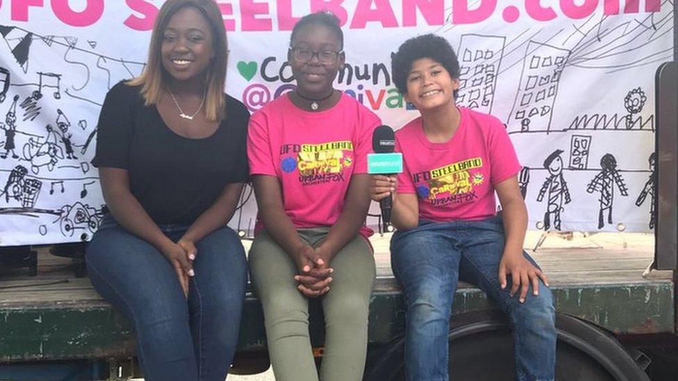 During Carnival, there is lots of music and dancing. These kids are part of a steel band.