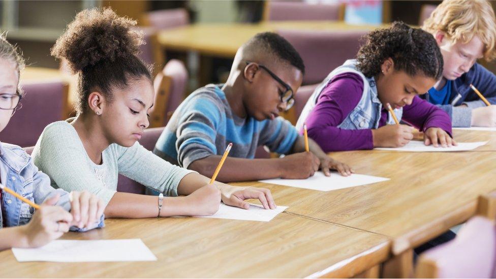 four children sit a test