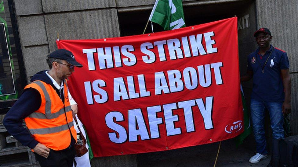 Union members man a picket line at Victoria station