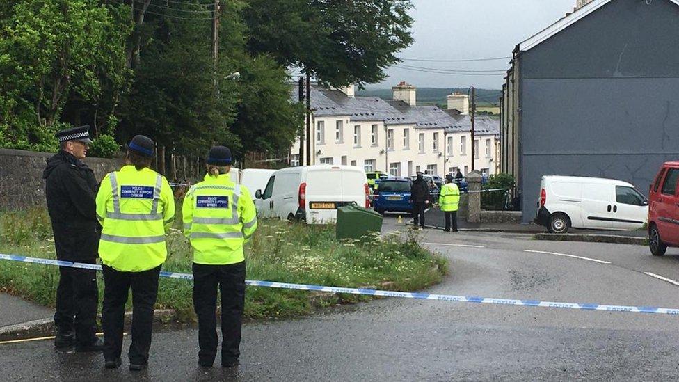 Officers outside cordon on Burrator Avenue